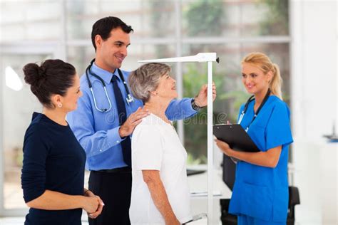 General Practitioner Examining Patient