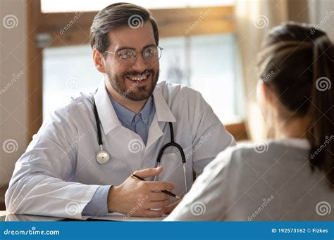 General Practitioner Listening to Patient