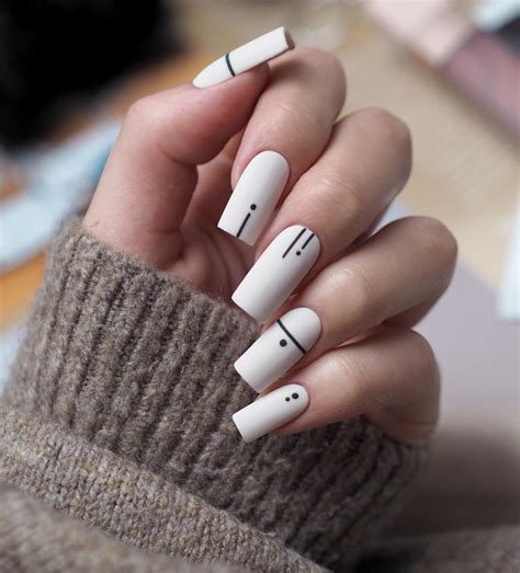 Geometric nail art design with bold shapes and patterns