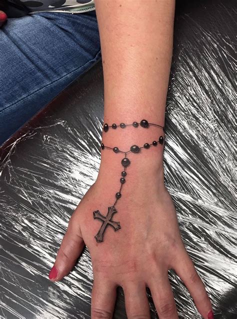 The process of getting a rosary tattoo