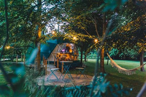 A luxurious glamping tent in a serene natural setting