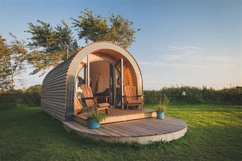 A modern glamping pod with a private deck