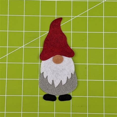 A gnome applique pattern on a sewing machine