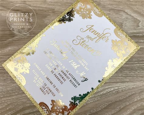 Gold foil wedding invitation with elegant illustrations and ribbon