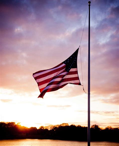 A flag flying at half-mast on a memorial day