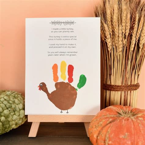 Handprint Turkey Poem Printable featuring a cute turkey with a pilgrim hat