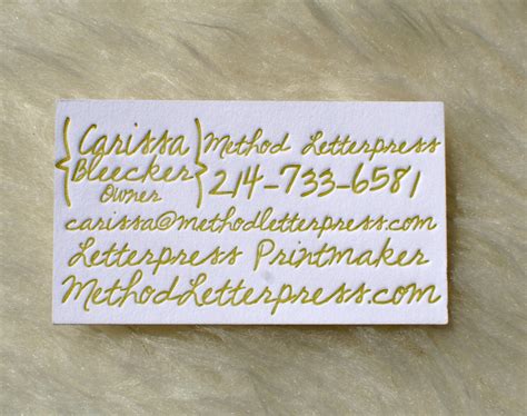 A handwritten note on a business card