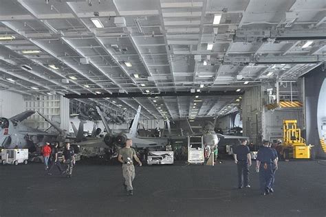 Hangar deck operations on an aircraft carrier