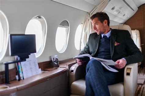 Flight attendant serving a high-net-worth individual on a private jet