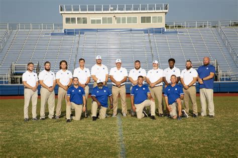 High school football players setting goals