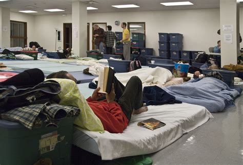 Pregnant woman speaking with a homeless shelter counselor