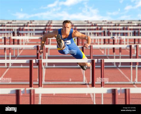 A hurdler clearing a hurdle