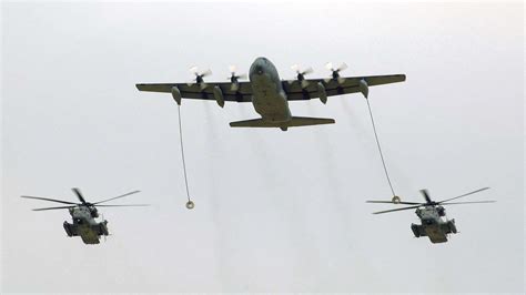 Tanker aircraft refueling a fighter jet