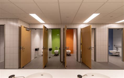 A person using a wheelchair in a single-occupancy restroom