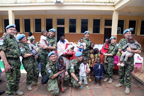 Infantry members providing humanitarian aid