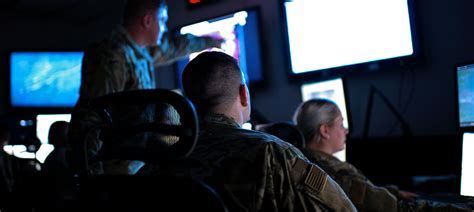 Intelligence analyst working at a computer terminal