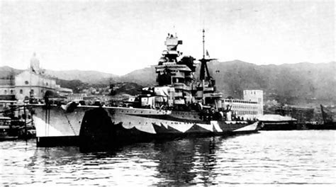 An Italian cruiser engaging enemy ships during a naval battle