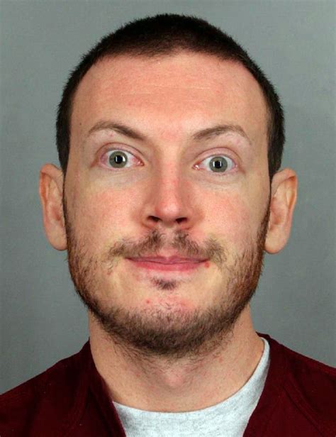 James Holmes being arrested