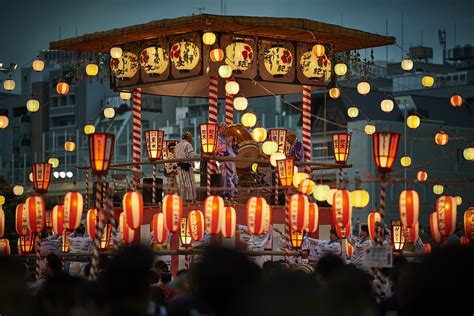 People celebrating a festival with traditional Japanese decorations