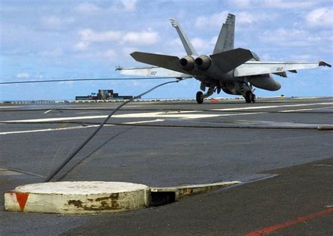 Jet landing on an aircraft carrier