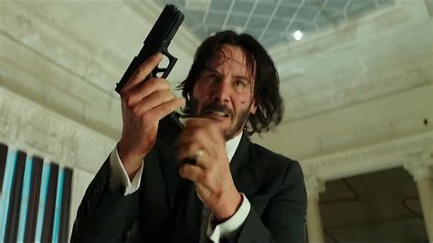 John Wick holding a gun