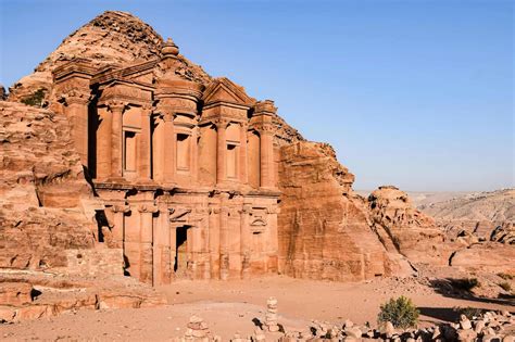 Tourists in Petra, Jordan, with a police officer in the background