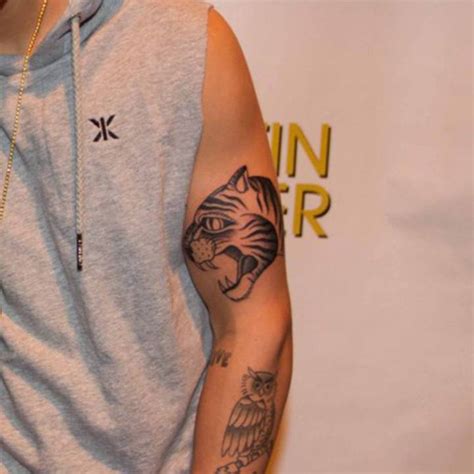 Justin Bieber's tiger tattoo on his arm