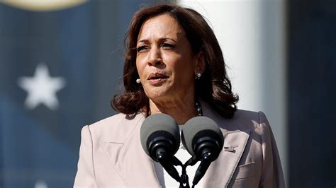 Kamala Harris speaking at a podium