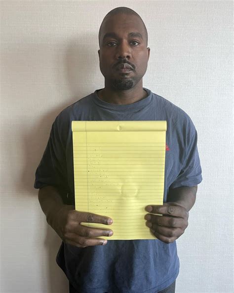 Kanye West holding a paper with a meme