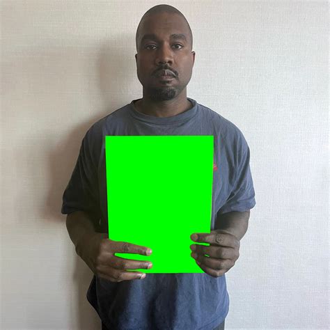 Kanye West holding a paper template