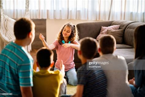 Kids playing charades and laughing