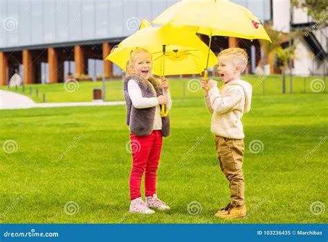 Kids Playing with Umbrellas