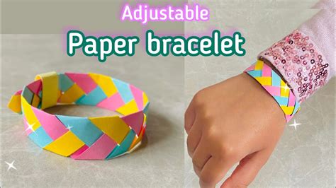 Kids proudly wearing their handmade paper bracelets