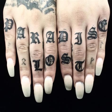 Various knuckle tattoo designs on display