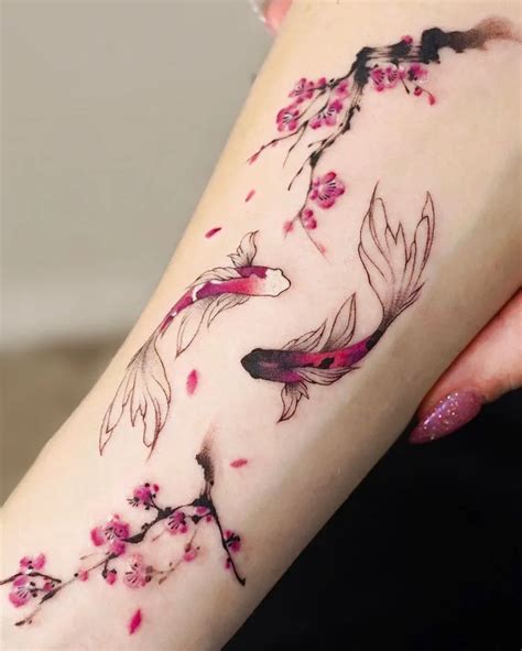 Koi carp tattoo featuring a combination of different elements, such as cherry blossoms and water