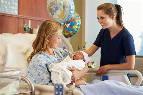 Labor and delivery nurse assisting a patient in labor