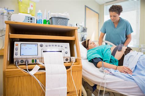 Labor and delivery nurse monitoring a fetal heart rate