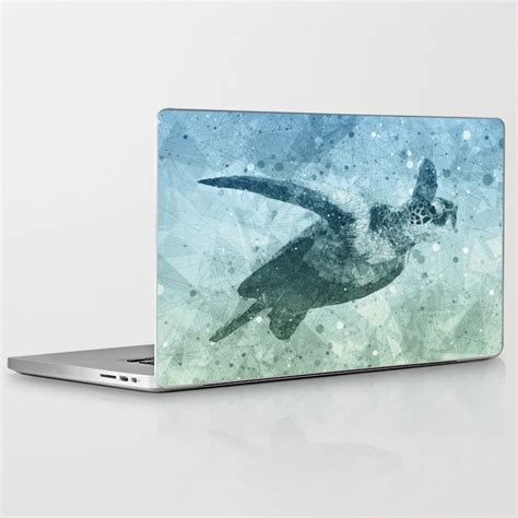 A laptop skin decorated with square printable stickers