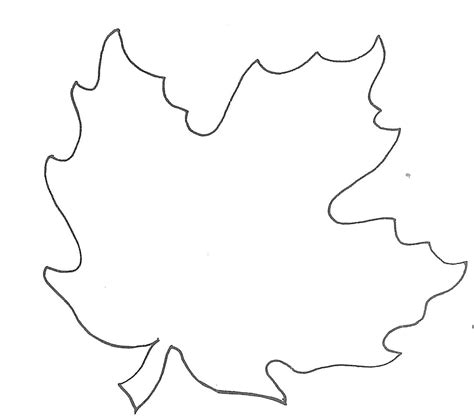 A large leaf template printed on paper, with a pencil and a ruler nearby