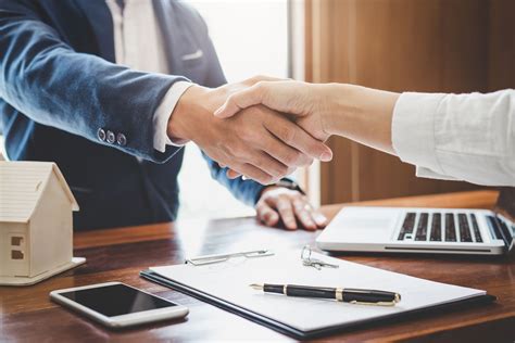 A lawyer speaking with a client in a conference room