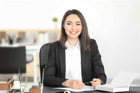 A lawyer attending a conference, with a notebook and pen