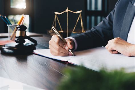 A lawyer attending a conference, with a notebook and pen