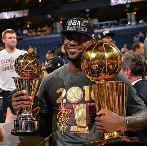 Lebron James holding the NBA championship trophy