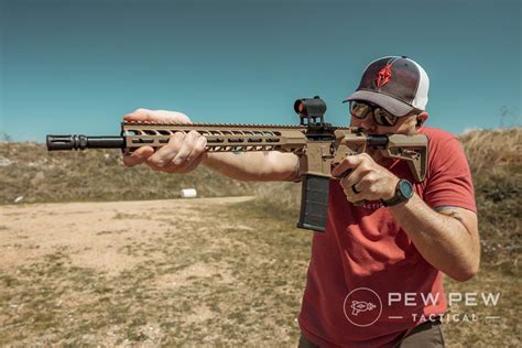 Left-handed shooter standing at a range