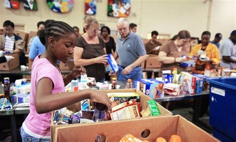 A person donating food to a legitimate food bank