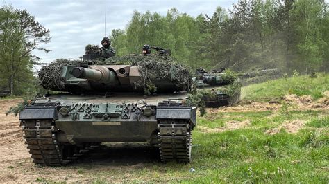 Crew members operating the Leopard tank