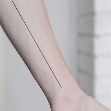 Line tattoo on the wrist