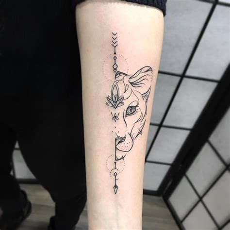 Minimalist lioness tattoo