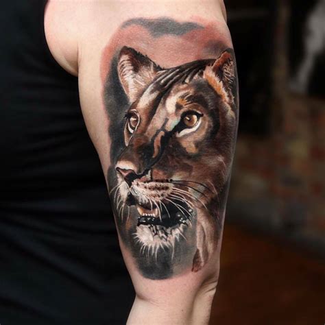 Realistic lioness tattoo