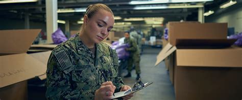 A logistics specialist working on a computer